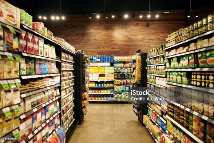 Shot of fully stocked isles in a grocery store during the day